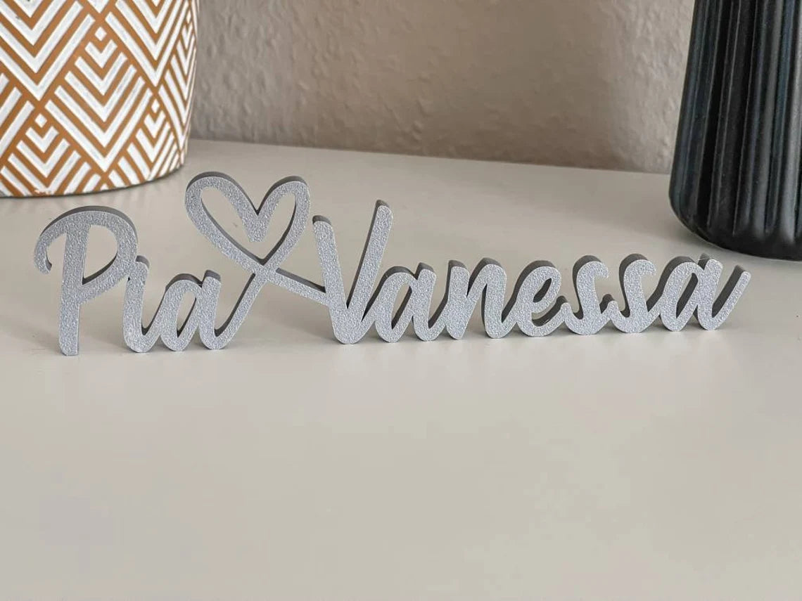 Schriftzug personalisiert mit zwei Namen und Herz